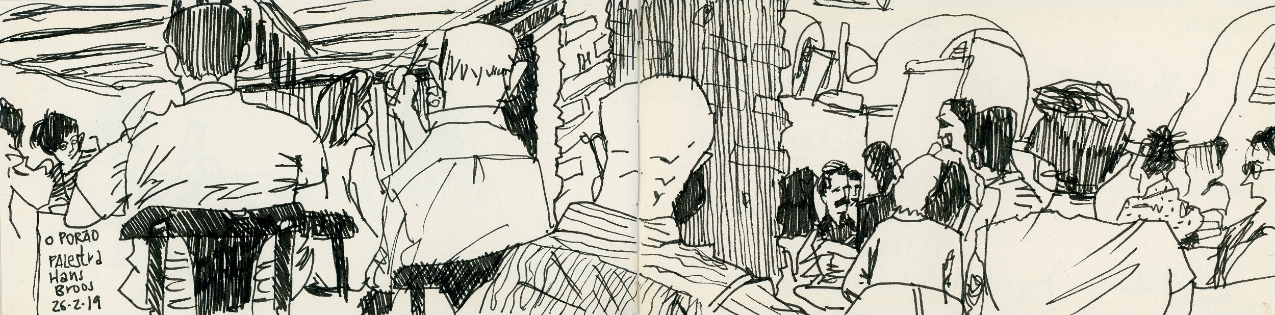 Caderno aberto com desenho dos participantes em página dupla