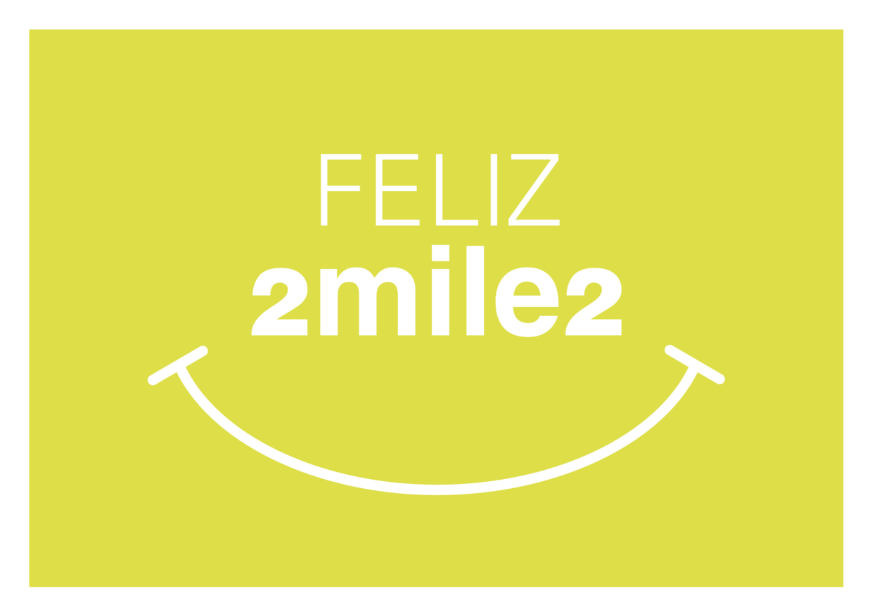 Cartao de ano novo de 2002, onde se lê: “feliz 2 mil e 2”. “2 mil e 2“ está escrito sem espaço, formando também a palavra “smiles”. Embaixo, há o desenho de uma boca sorrindo